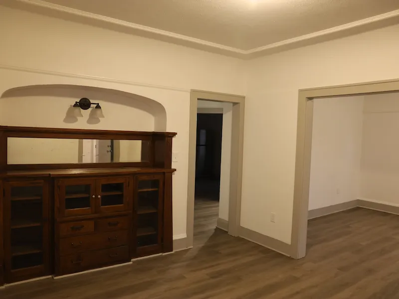 Old interior room with beige walls and dark wood furniture