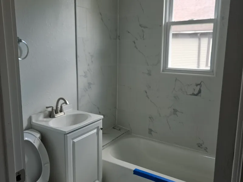 Updated bathroom with light tile