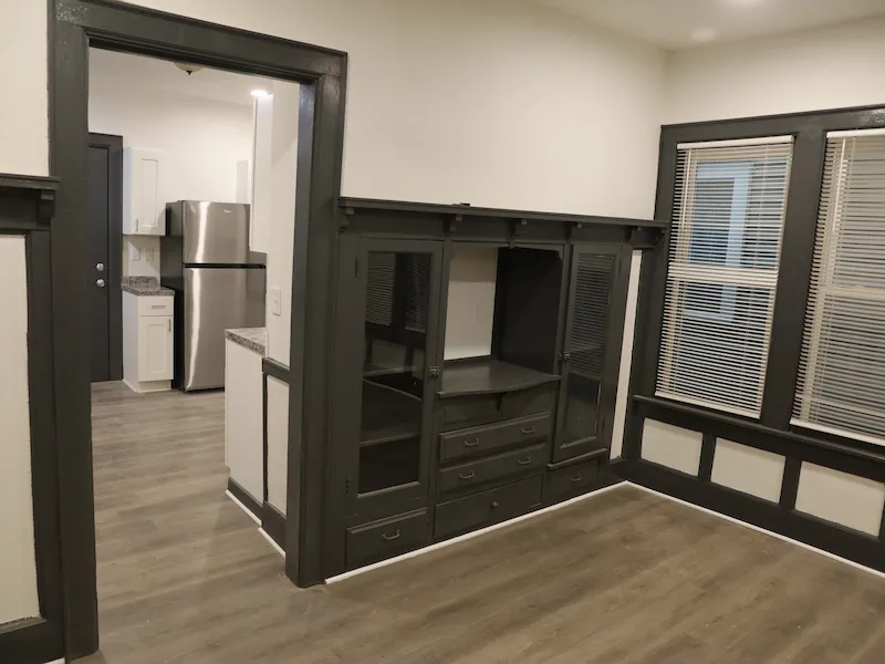 Interior of renovated room with white walls and gray accents