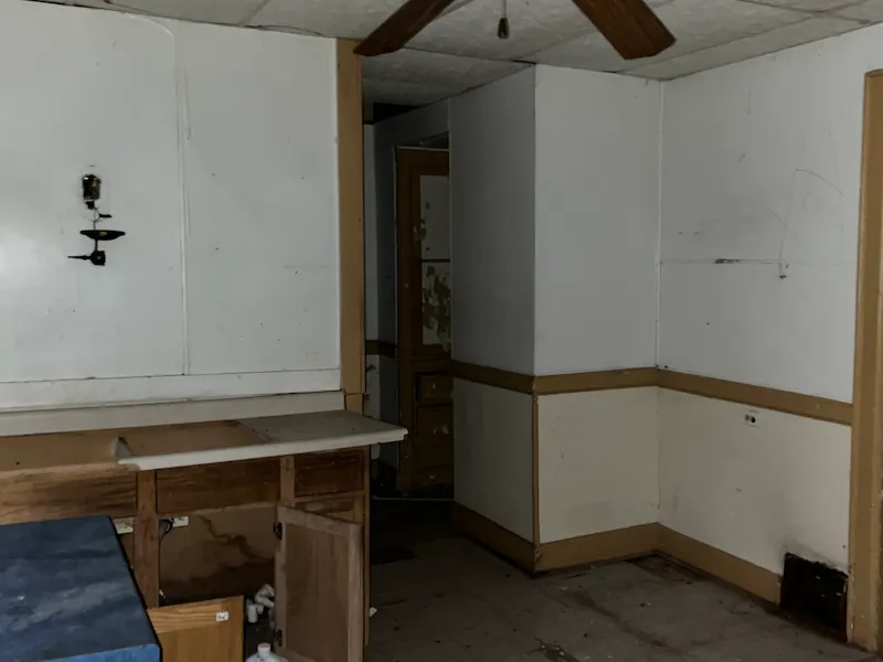 Old interior room with white and beige walls and brown accents