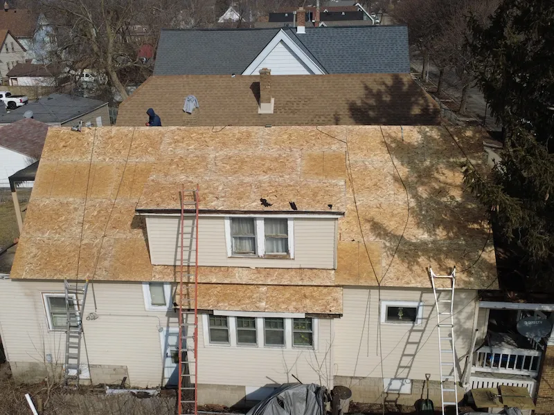 Overhead view of house with all roof shingles removed