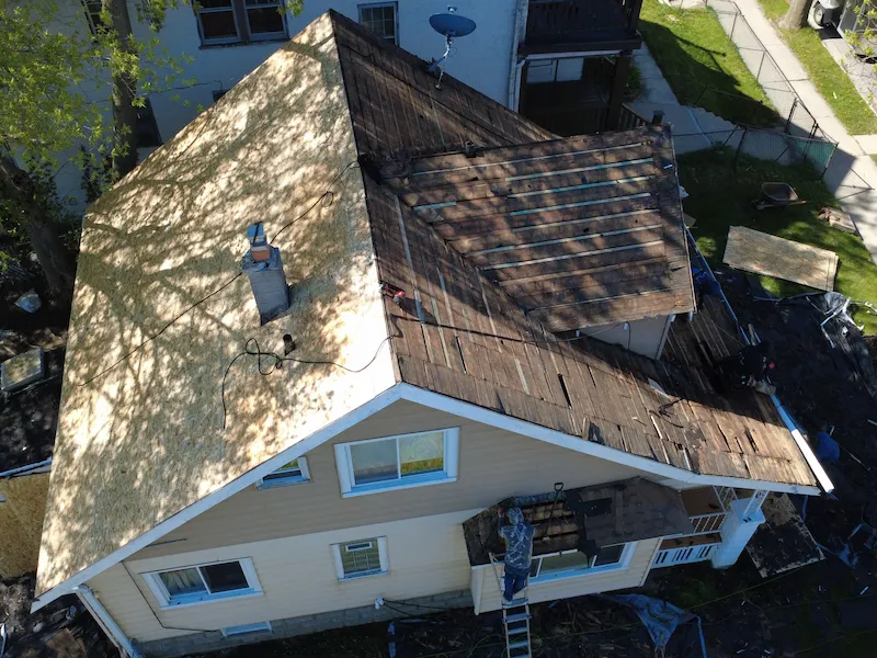 Overhead view of house with all roof shingles removed
