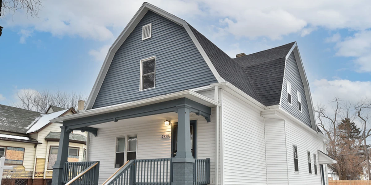 Completed home project with modern gray-blue and white exterior