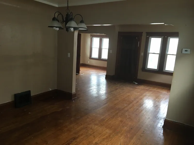 Dark room with wide entryway